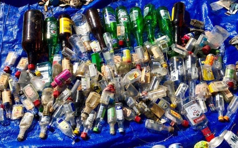glass bottles collected during beach cleanup