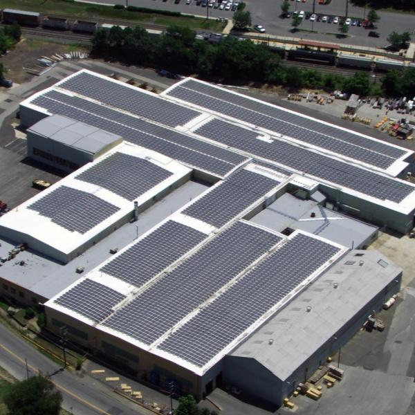 solar panels on top of industrial building's flat roof