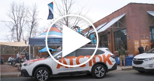 Subaru vehicle in front of brick building
